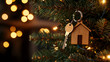 © Chanita - Close-up of wooden house keychain on a Christmas tree, modern Scandinavian studio interior in the background, warm ambient lighting creating a cozy atmosphere space for text