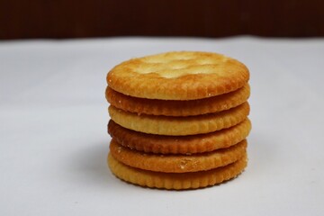 stack of round salted biscuits isolated on white