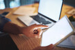 © peopleimages.com - Hands, tablet and blank screen in office, night and planning with project, review and mock up space at startup. Entrepreneur, person and touchscreen for search, click and app ux at creative agency