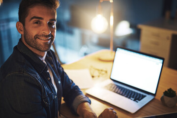 Business man, laptop and portrait at night for project management, networking and communication in office. Employee, technology and late deadline for proposal, report and research with happy face