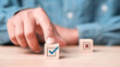 © Smile Studio AP - Businessman select blue correct sign mark between Red Cross mark which print screen on wooden for approve and reject business project proposal concept.