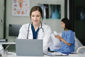 medicine, healthcare and people concept - doctor with tablet pc computer talking to woman patient at hospital.