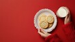 © santima - Cookies and milk on a red background.