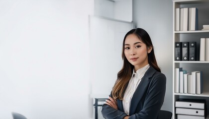 Confident businesswoman in a suit, smiling and looking directly at the camera