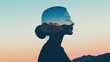 © Tin - Silhouette of a woman with a landscape inside her head against a gradient sky.