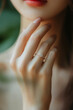 © Poramet - Close up of an elegant engagement diamond ring on woman finger