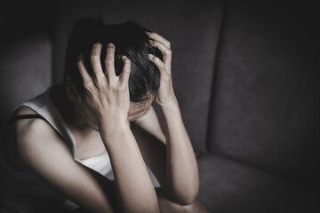 Depressed woman, person sitting alone on the floor felling sad worry. Stress, suicidal thoughts.