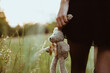 © Westend61 - Young woman holding stuffed toy