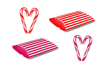Wall Mural - christmas red and white striped paperboard pillow box gift packaging with candy cane peppermint stic