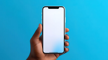 Superb hands holding smart phone with blank white screen isolated on blue background