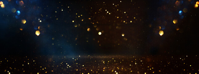 Wall Mural - abstract glitter black, blue and gold lights background. de-focused