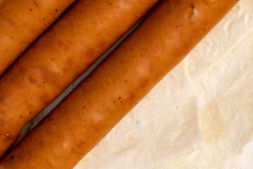 Wall Mural - fried pork sausages on a wheat tortilla