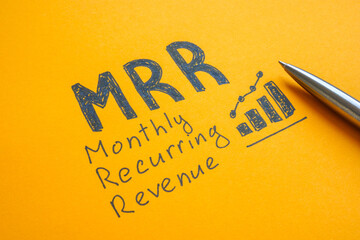 Close-up of MRR monthly recurring revenue symbolizing financial stability.