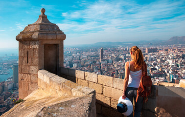 Tour tourism in Alicante, traveler woman looking at panoramic view of cityscape of Alicante, Spain