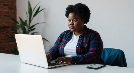 African web developer coding on a laptop serious demeanor casual attire plain white background chubby build late twenties female