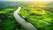 © apichat - Serene Aerial View of Lush Green Landscape and River