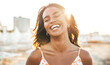 © Davide Angelini - Happy black woman smiling at sunset outside - Cheerful young female laughing outdoors - Positive vibes and well being people life style concept