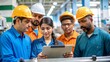 © N7 - Indian Production Line Workers - A group of workers collaborating on an assembly line.