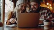 © Erich - Smiling Team Members Collaborating on Laptop in Cozy Workspace