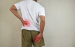 © syahrir - Man feeling nerve pain from lower back and goes down to legs. Sciatica concept