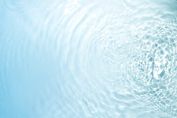 Wall Mural - the clear blue surface of the water gradients from light to dark.