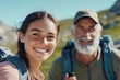 © Milos - A young woman and her elderly companion enjoy an adventurous hike under a clear blue sky, exuding joy and the joy of companionship in nature's embrace.
