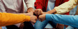 © Summit Art Creations - Startup company employee team stacking hand together symbolize successful group of business partnership and strong collective unity teamwork in community workplace in panoramic banner. Synergic