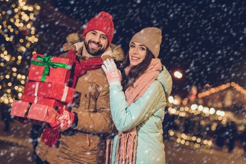 Poster - Photo of sweet beautiful wife husband walking buying presents boxes smiling outside city fair street