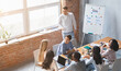 © Prostock-studio - Young creative business team listening to marketing report during morning meeting at loft office