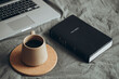 © sav_an_dreas - Cup of coffee, Bible book and laptop on gray bed in bedroom, cozy mood.