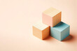 © Andbiz - Pastel wooden cubes on a light background. Space for text.