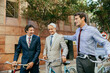© Marko Geber - Businessmen commuting to work on bicycles