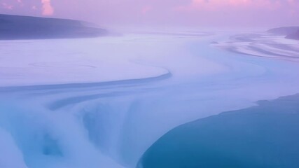 Wall Mural - Turquoise river water flows through a snowy, icy landscape at sunset, creating surreal colors that blend beautifully. The scene captures a serene and tranquil winter environment
