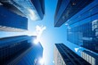 © AndiAzis - Aerial view of skyscrapers against a bright blue sky.