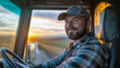 © Birgit Reitz-Hofmann - Young smiling Truck driver smiling inside truck cab
