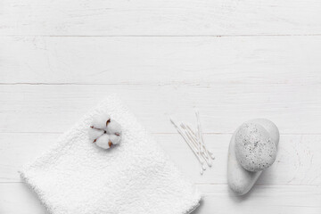 Wall Mural - Beautiful composition with clean soft towel, cotton buds and spa stones on white wooden background