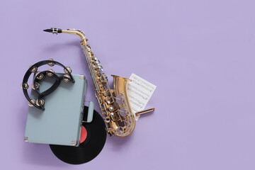 Wall Mural - Saxophone, record player, tambourine and music notes on lilac background