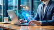 © KingKongThePitbull - Professional's hands interacting with a holographic interface on a laptop in a modern, futuristic office environment