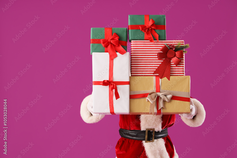 Santa Claus with Christmas presents on violet background