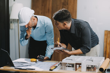 Team Engineers with draft plan of building on constructing site. Engineer work on site. engineer visit and inspection site engineer. Inspector engineer check and working on site.