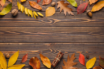 Canvas Print - Composition with beautiful fallen leaves, spices and acorns on wooden background