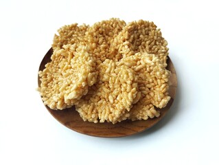 Rengginang or Indonesian traditional cracker made from glutinous rice, isolated on white background with high angle view setup 