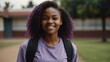 © Alteisen Riese - female african girl in purple casual wear on school yard background model portrait smiling for ad concept space for text