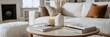 © Somsom - A chic and elegant coffee table setup featuring fashion magazines a designer candle and a stylish vase creating a visually appealing and inviting home aesthetic