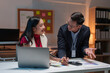 © Phimwilai - Team of Asian businessmen and women holding cell phones to contact customers Get business information to discuss financial document details. online marketing The concept of successful teamwork.