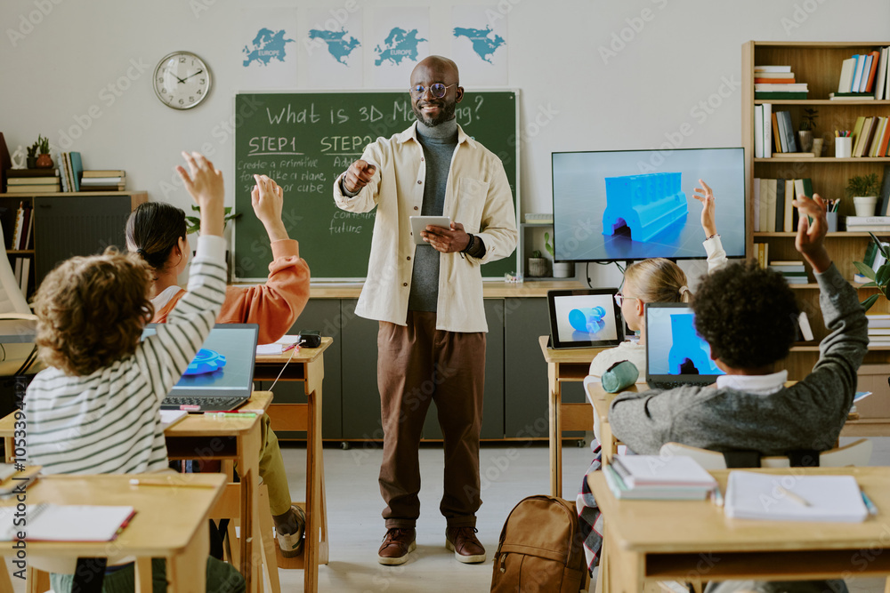 Educator guiding excited students through 3D modeling lesson. Classroom ...
