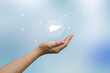 © chinnarach - close up man hand gesture and show liver organ icon over blur background with shield for awareness campaign of healthcare of people lifestyle and cancer or illness prevention concept