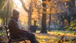 ©  VladaToday - A man in an autumn park. A man with a laptop on a bench. Freelancer