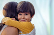 © peopleimages.com - Hug, love and adoption with family at home for foster care, bonding and support mockup. Child welfare, placement success and security with mother and son in living room for happiness together