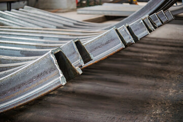 Metal blanks arranged neatly in an industrial workshop showcasing manufacturing processes and materials used in production